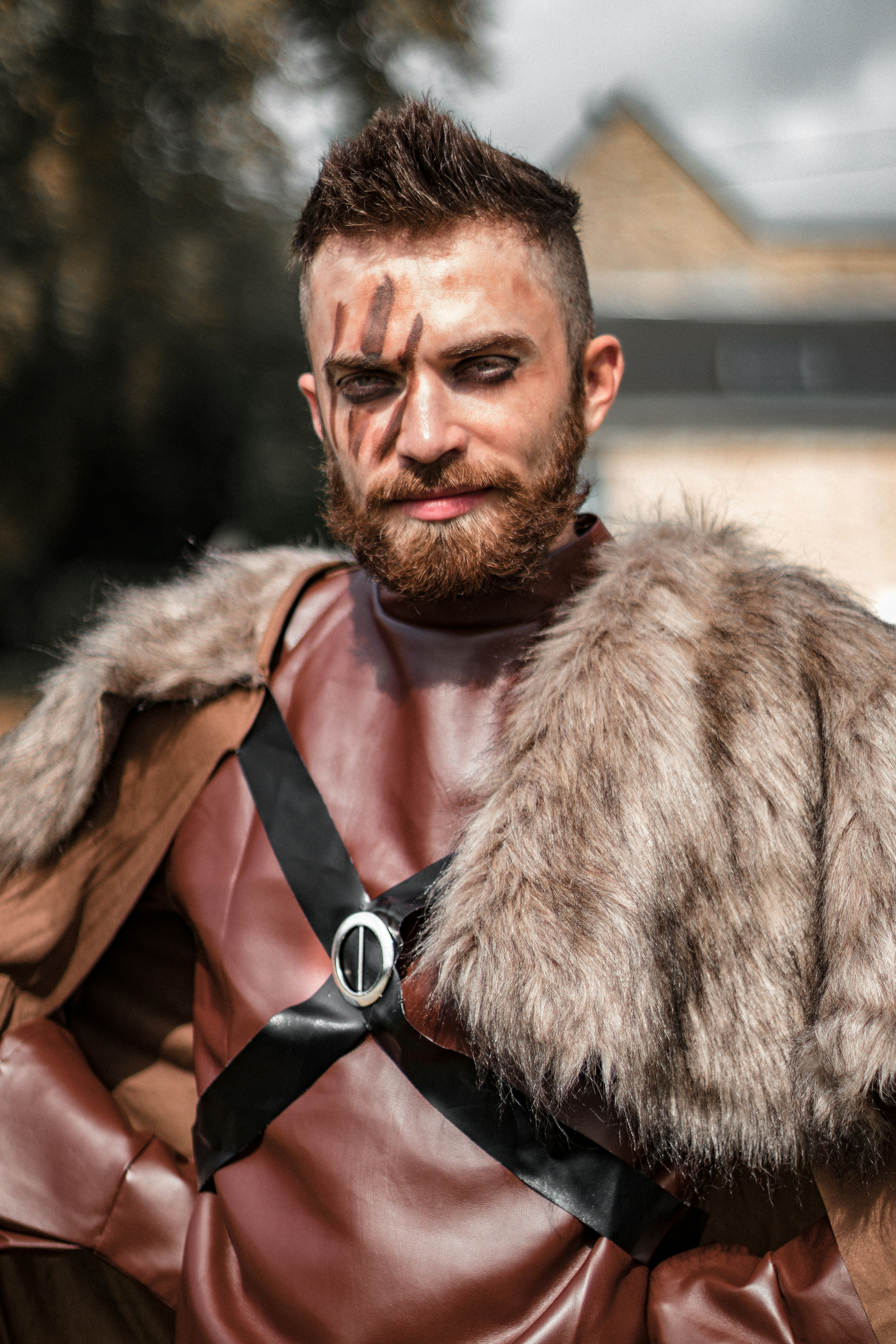 man in brown fur coat